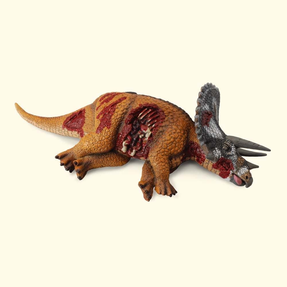 Dinosaurio de juguete Triceratops herido - Imagen 1